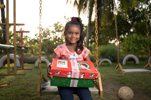 Child receives gift from Operation Christmas Child